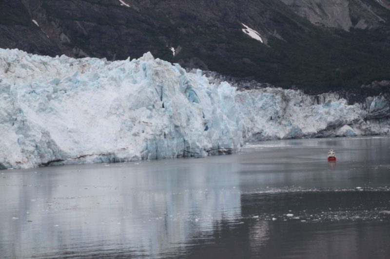 You can see how tall the glacier is comparing to little tour boat