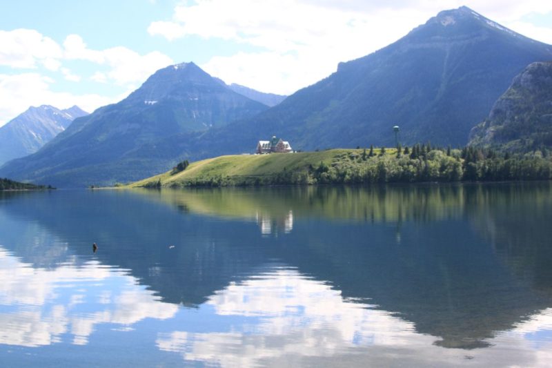 A lake front with beautiful stones at shore and good view of Prince of Wales Hotel